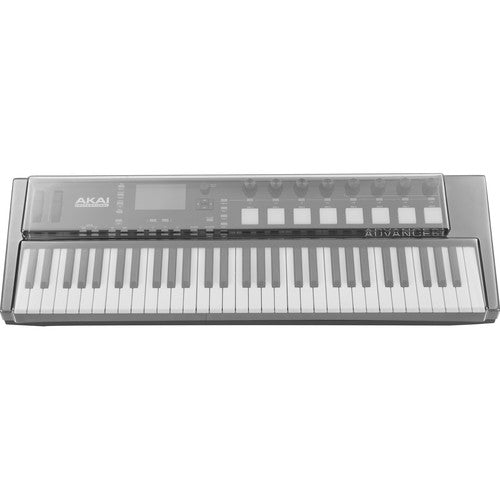 Decksaver cover for Akai Advance 61 MIDI keyboard controller, clear protective plastic cover on the keyboard in a studio setting.