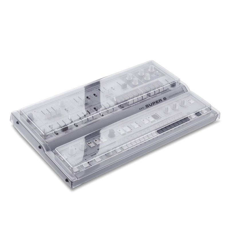 Decksaver cover for Super 6 desktop synthesizer, protective plastic cover fitting over the synthesizer for safe storage.